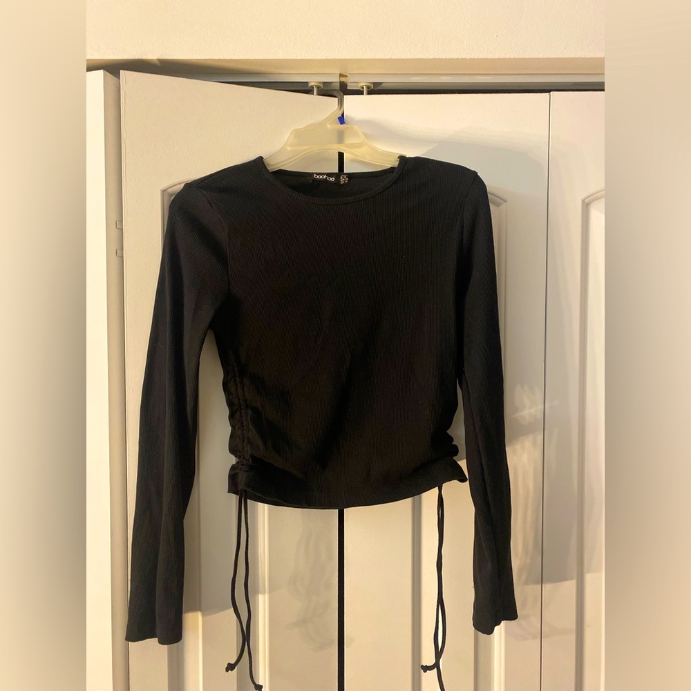 New never worn. Long sleeve crop top. Tie strings on the sides.